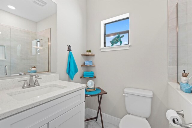 7 Menorca Way, Palm Coast, FL 32137 - full bathroom featuring a tile shower, vanity, toilet, baseboards, and visible vents