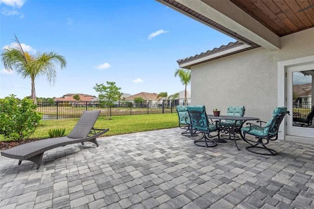 7 Menorca Way, Palm Coast, FL 32137 - view of patio / terrace featuring fence, a residential view, and outdoor dining area