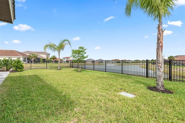 7 Menorca Way, Palm Coast, FL 32137 - view of yard featuring a fenced backyard, a water view, and a residential view