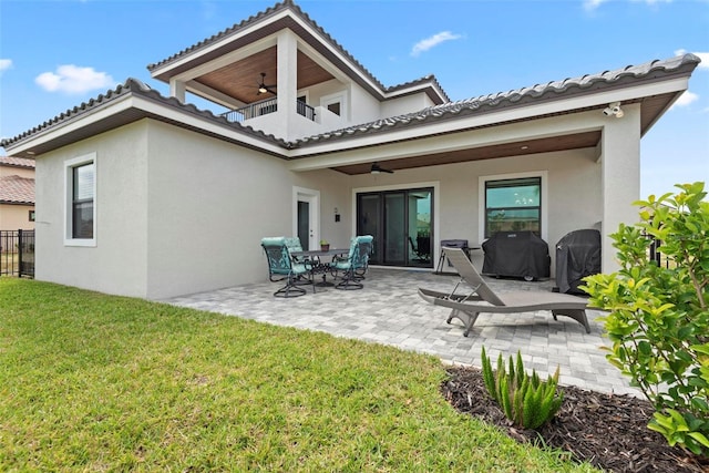 7 Menorca Way, Palm Coast, FL 32137 - back of property with a patio, ceiling fan, a yard, and stucco siding
