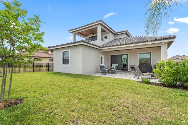 7 Menorca Way, Palm Coast, FL 32137 - back of property featuring fence, ceiling fan, stucco siding, a patio area, and a yard