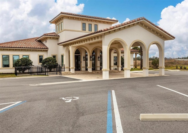 7 Menorca Way, Palm Coast, FL 32137 - exterior space featuring uncovered parking, stucco siding, and a tile roof