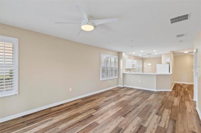 500 Canopy Walk Ln Unit 515, Palm Coast, FL 32137 - unfurnished living room with light wood finished floors, a ceiling fan, and recessed lighting