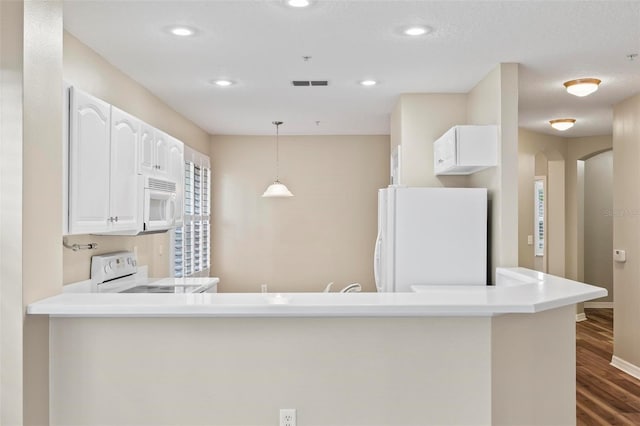 500 Canopy Walk Ln Unit 515, Palm Coast, FL 32137 - kitchen featuring white appliances, dark wood-style flooring, white cabinets, recessed lighting, and hanging light fixtures