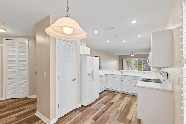500 Canopy Walk Ln Unit 515, Palm Coast, FL 32137 - kitchen featuring white appliances, light wood-style flooring, a ceiling fan, light countertops, and recessed lighting