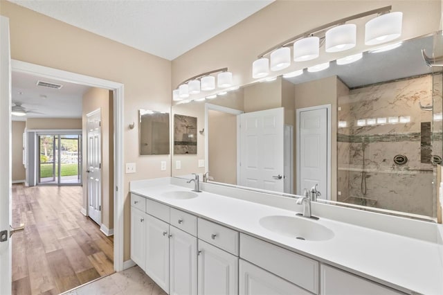 500 Canopy Walk Ln Unit 515, Palm Coast, FL 32137 - bathroom featuring a stall shower, double vanity, and a ceiling fan