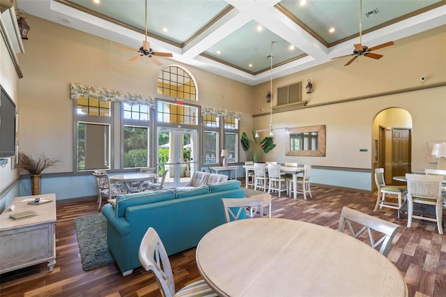 500 Canopy Walk Ln Unit 515, Palm Coast, FL 32137 - living area with ceiling fan, a towering ceiling, arched walkways, wood finished floors, and beam ceiling