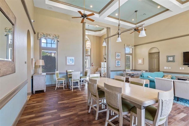 500 Canopy Walk Ln Unit 515, Palm Coast, FL 32137 - dining room featuring a ceiling fan, arched walkways, a towering ceiling, wood finished floors, and coffered ceiling