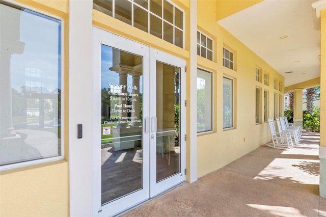 500 Canopy Walk Ln Unit 515, Palm Coast, FL 32137 - property entrance with stucco siding and french doors