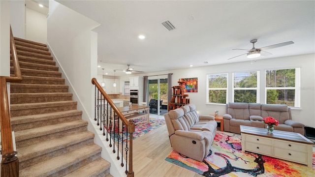 314 Red Barn Rd, Saint Augustine, FL 32092 - living room featuring visible vents, stairway, ceiling fan, and light wood-type flooring
