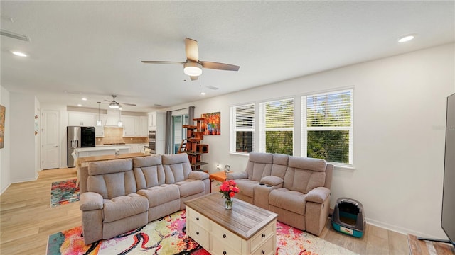 314 Red Barn Rd, Saint Augustine, FL 32092 - living room featuring light wood finished floors, baseboards, recessed lighting, and a ceiling fan