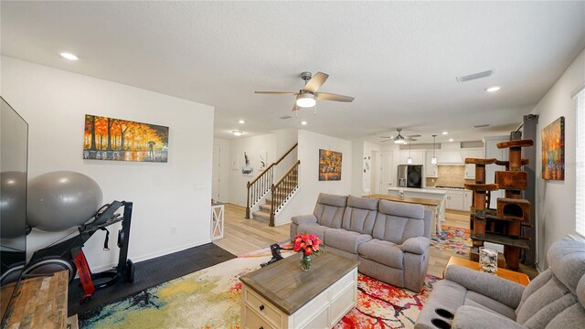 314 Red Barn Rd, Saint Augustine, FL 32092 - living room with visible vents, stairs, recessed lighting, a ceiling fan, and light wood-type flooring