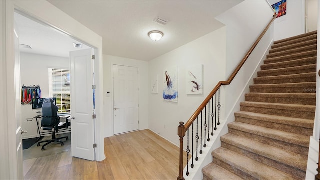 314 Red Barn Rd, Saint Augustine, FL 32092 - foyer entrance featuring stairs, light wood-type flooring, visible vents, and baseboards