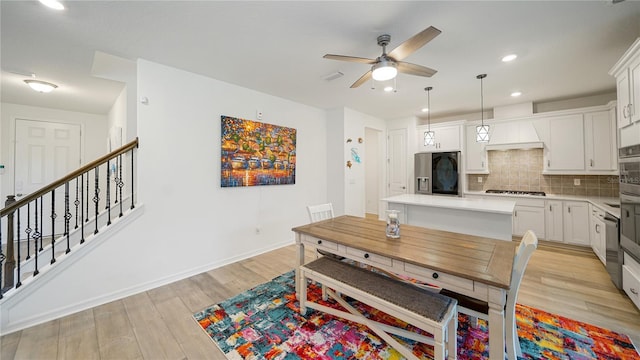 314 Red Barn Rd, Saint Augustine, FL 32092 - dining area with stairs, a ceiling fan, light wood-style flooring, baseboards, and recessed lighting