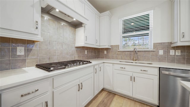 314 Red Barn Rd, Saint Augustine, FL 32092 - kitchen with light countertops, a sink, backsplash, appliances with stainless steel finishes, and custom range hood
