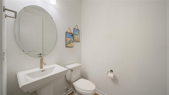 314 Red Barn Rd, Saint Augustine, FL 32092 - bathroom with a sink, baseboards, and toilet