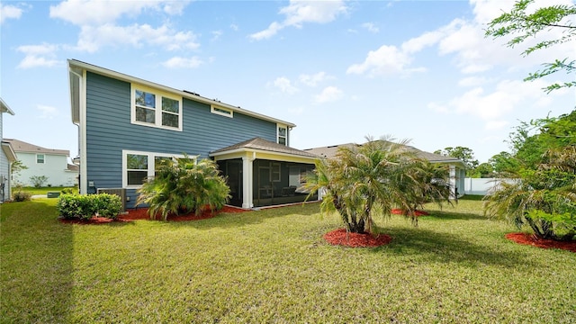 314 Red Barn Rd, Saint Augustine, FL 32092 - back of property featuring a sunroom and a lawn