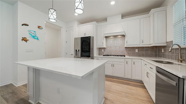314 Red Barn Rd, Saint Augustine, FL 32092 - kitchen featuring white cabinets, a sink, appliances with stainless steel finishes, and light wood-style floors