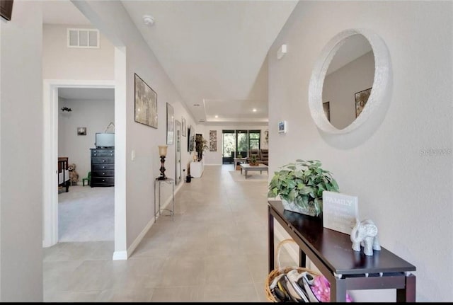 hallway featuring recessed lighting, baseboards, and visible vents