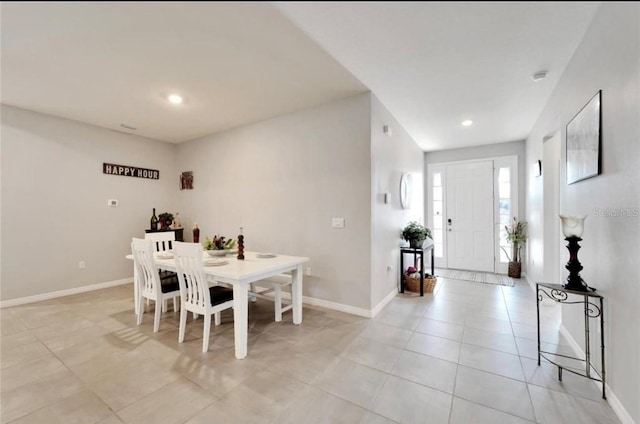 dining space with baseboards, recessed lighting, and light tile patterned floors