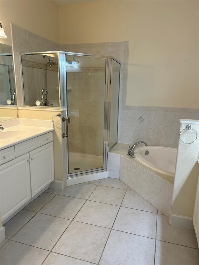15 Ocean Crest Way Unit 1335, Palm Coast, FL 32137 - bathroom with a garden tub, vanity, tile patterned floors, and a shower stall