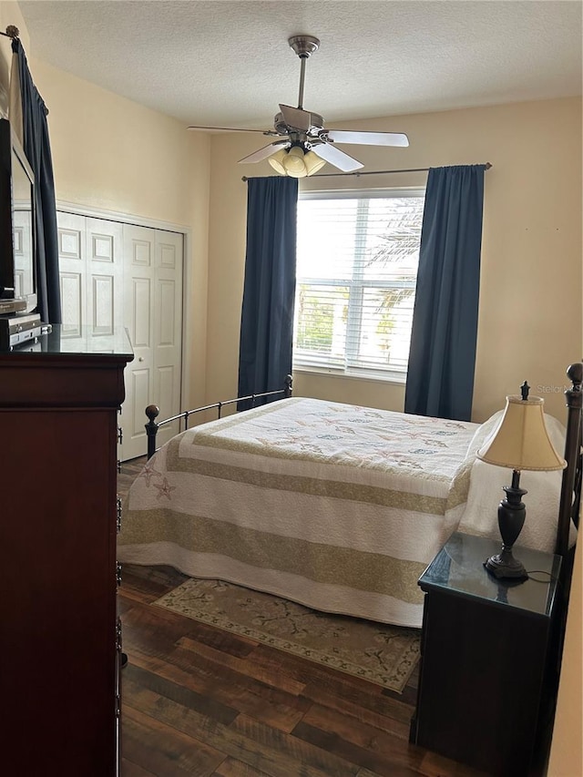 15 Ocean Crest Way Unit 1335, Palm Coast, FL 32137 - bedroom featuring dark wood-style flooring, a textured ceiling, and ceiling fan