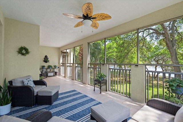 45 Riverview Bnd S Unit 1926, Palm Coast, FL 32137 - sunroom / solarium with a ceiling fan, a textured wall, outdoor lounge area, and tile patterned flooring