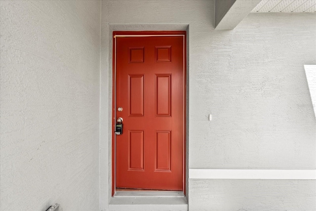 29 Secretary Trl, Palm Coast, FL 32164 - doorway to property featuring stucco siding