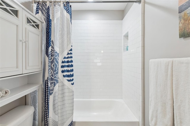 full bathroom with toilet and shower / bath combination with curtain