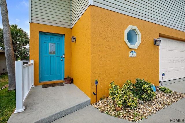 1951 N Daytona Ave, Flagler Beach, FL 32136 - doorway to property with stucco siding