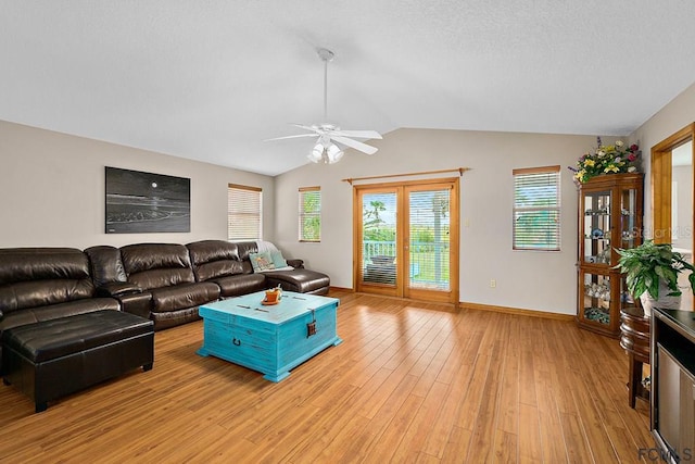 1951 N Daytona Ave, Flagler Beach, FL 32136 - living area with lofted ceiling, light wood-style flooring, a ceiling fan, and plenty of natural light