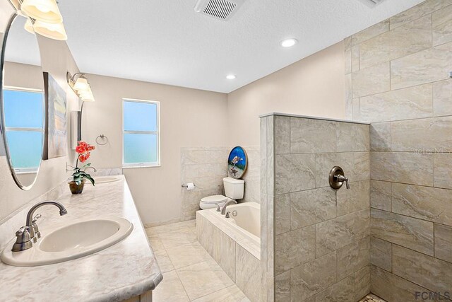 1951 N Daytona Ave, Flagler Beach, FL 32136 - full bath with visible vents, a sink, a garden tub, and double vanity