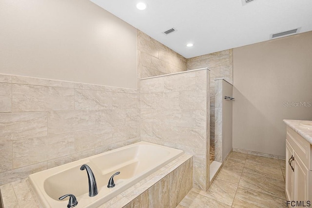 1951 N Daytona Ave, Flagler Beach, FL 32136 - bathroom featuring visible vents, a walk in shower, and a bath