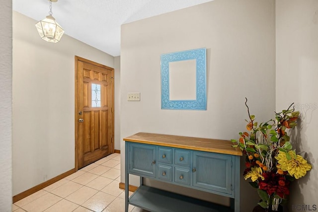 1951 N Daytona Ave, Flagler Beach, FL 32136 - foyer entrance with light tile patterned floors and baseboards