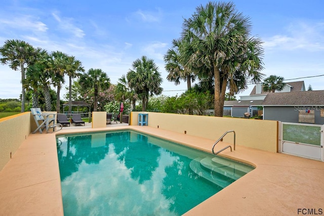 1951 N Daytona Ave, Flagler Beach, FL 32136 - view of swimming pool with a fenced in pool and a patio