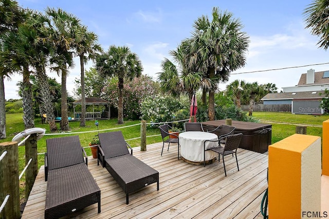 1951 N Daytona Ave, Flagler Beach, FL 32136 - wooden terrace with outdoor dining space, a gazebo, and a yard