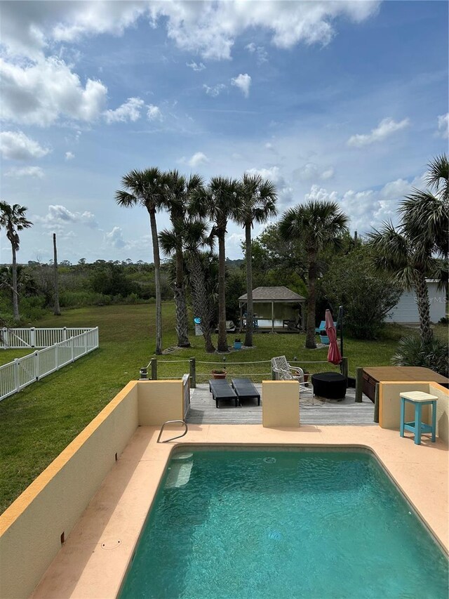 1951 N Daytona Ave, Flagler Beach, FL 32136 - view of pool featuring fence, a fenced in pool, a yard, and a patio area