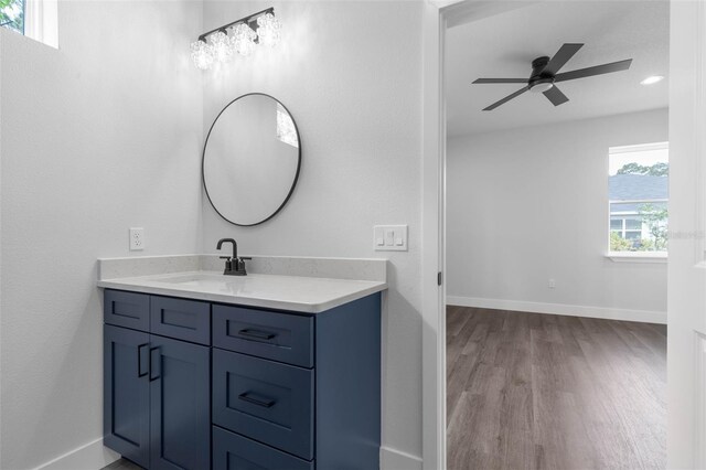 6 Rainbow Ln, Palm Coast, FL 32164 - bathroom featuring wood finished floors, vanity, ceiling fan, and recessed lighting