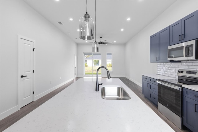 6 Rainbow Ln, Palm Coast, FL 32164 - kitchen featuring appliances with stainless steel finishes, recessed lighting, backsplash, open floor plan, and pendant lighting