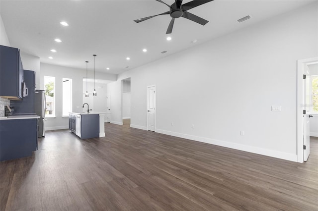 6 Rainbow Ln, Palm Coast, FL 32164 - unfurnished living room with ceiling fan, recessed lighting, and dark wood-style floors