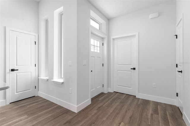 6 Rainbow Ln, Palm Coast, FL 32164 - foyer with wood finished floors and baseboards