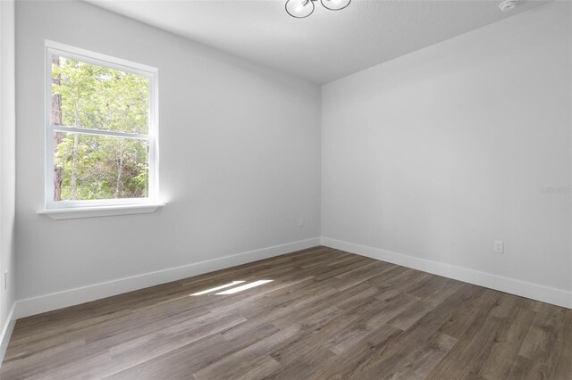 6 Rainbow Ln, Palm Coast, FL 32164 - spare room with plenty of natural light and wood finished floors