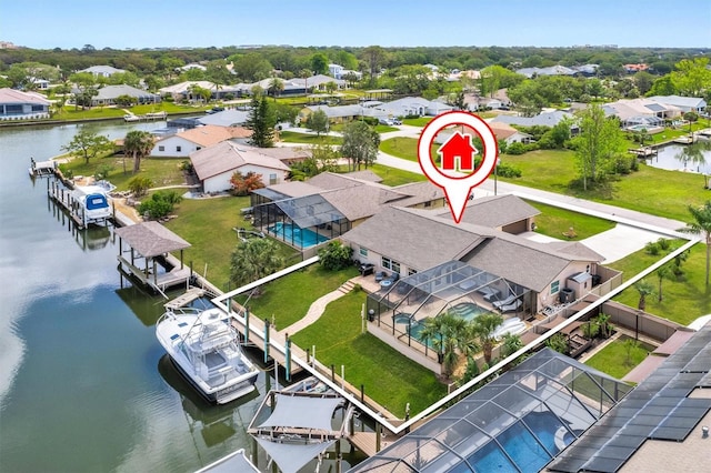 bird's eye view with a water view and a residential view