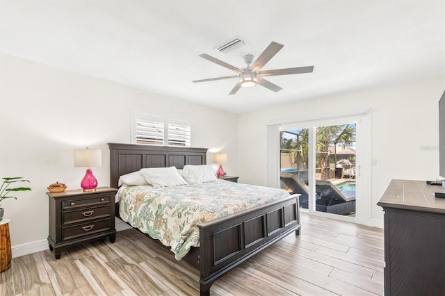 bedroom featuring access to exterior, a ceiling fan, light wood-type flooring, baseboards, and visible vents
