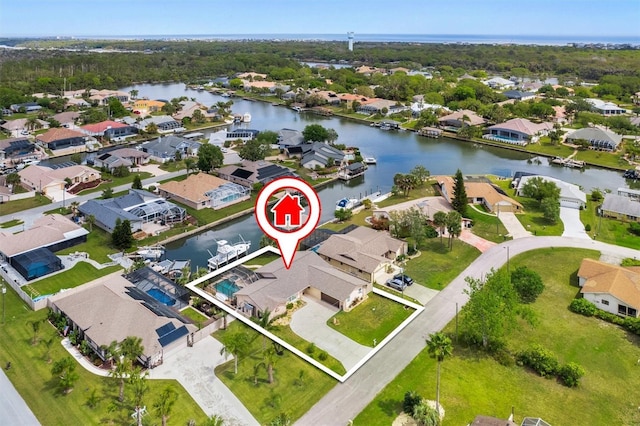 birds eye view of property featuring a residential view and a water view