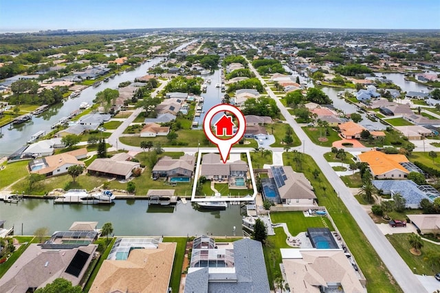 aerial view with a residential view and a water view