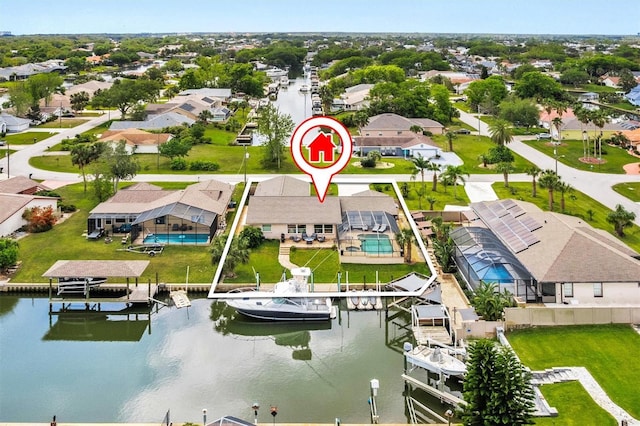 bird's eye view featuring a residential view and a water view