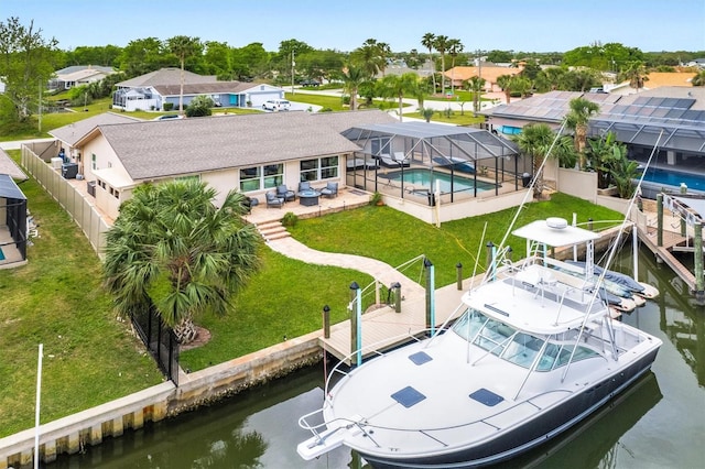 birds eye view of property with a water view and a residential view