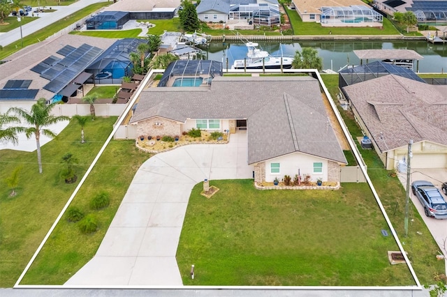 birds eye view of property featuring a residential view and a water view