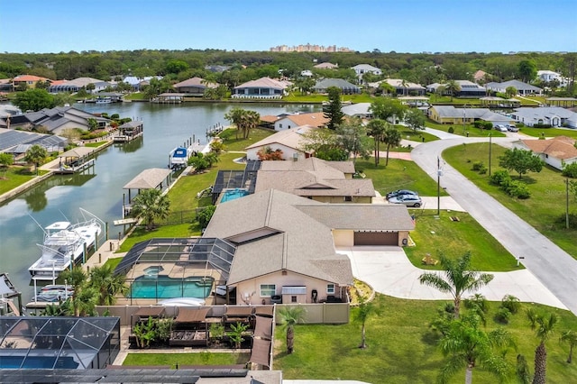 drone / aerial view with a residential view and a water view
